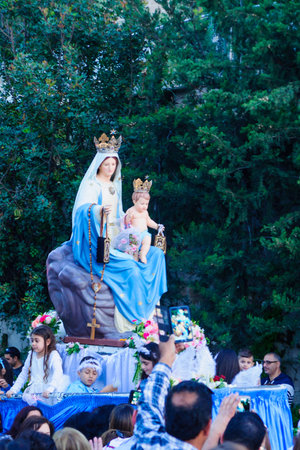 HAIFA, ISRAEL - APR 19, 2015: The statue of Mary is carried up by the local Christian community members, in the annual our lady of Mount Carmel parade, in Haifa, Israel. This annual event commemorates the hiding of Mary statue in WWIのeditorial素材