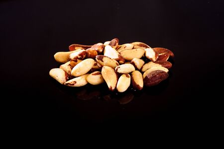 Brazil Nuts on a black backgroundの写真素材