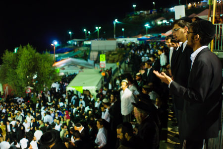 MERON ISRAEL  MAY 07 2015: A crowd of orthodox Jews attend and dance the annual hillulah of Rabbi Shimon Bar Yochai in Meron Israel on Lag BaOmer Holiday.のeditorial素材