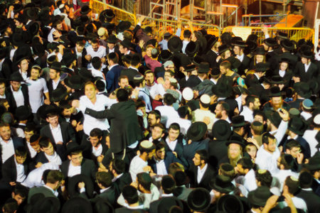 MERON ISRAEL  MAY 07 2015: A crowd of orthodox Jews attend and dance the annual hillulah of Rabbi Shimon Bar Yochai in Meron Israel on Lag BaOmer Holiday.のeditorial素材
