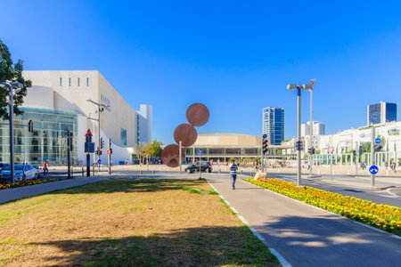 TEL AVIV ISRAEL  MAY 15 2015: Scene of the Rothschild Boulevard a mobile library and the Habima Square The Orchestra Plaza with visitors in Tel Aviv Israelのeditorial素材