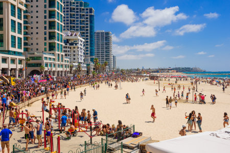 TEL AVIV ISRAEL  JUNE 12 2015: View of the beach of TelAviv the old city of Jaffa and the crowd Pride Parade participants in TelAviv Israel. Its part of an annual event of the LGBT communityのeditorial素材