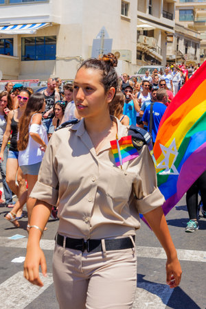 TEL AVIV ISRAEL  JUNE 12 2015: An Israel Female soldier march in the Pride Parade in the streets of TelAviv Israel. Its part of an annual event of the LGBT communityのeditorial素材