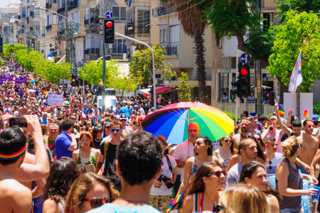 TEL AVIV ISRAEL  JUNE 12 2015: A crowd of people march in the Pride Parade in the streets of TelAviv Israel. Its part of an annual event of the LGBT communityのeditorial素材