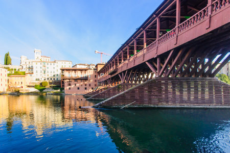 The Ponte Vecchio or Ponte degli Alpini bridge, and the Brenta river, in Bassano del Grappa, Veneto, Italyのeditorial素材
