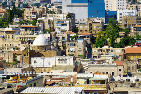 HAIFA, ISRAEL - JULY 21, 2015: Rooftop view of downtown, with religious and commercial buildings from various periods, in Haifa, Israelのeditorial素材