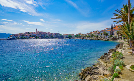 KORCULA, CROATIA - JUNE 26, 2015: Scene in the old town west side, with the walls, houses, boats, locals and visitors, in Korcula, Croatiaのeditorial素材