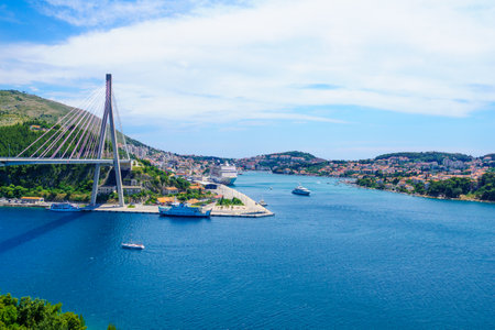 DUBROVNIK, CROATIA - JUNE 26, 2015: Scene of the Franjo Tudman Bridge, and the port of Gruz, with ferry boat, passenger ships and other vessels, in Dubrovnik, Croatiaのeditorial素材