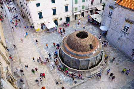 DUBROVNIK, CROATIA - JUNE 26, 2015: Scene at Big Onofrio's Fountain, crowded with locals and tourists, in Dubrovnik, Croatiaのeditorial素材