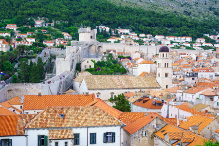 DUBROVNIK, CROATIA - JUNE 26, 2015: Scene of the old city walls, with locals and tourists, in Dubrovnik, Croatiaのeditorial素材