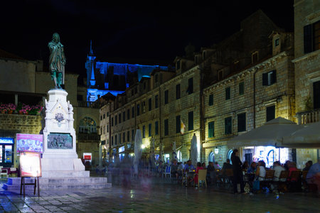 DUBROVNIK, CROATIA - JUNE 26, 2015: Night scene of the Gunduliceva Poljana square, with restaurants, locals and tourists, in Dubrovnik, Croatiaのeditorial素材