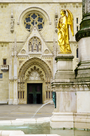 Holy Mary column with angels and fountain and the facade of Zagreb Cathedral, in Zagreb, Croatiaの写真素材