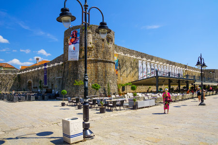BUDVA, MONTENEGRO - JUNE 29, 2015: Scene of the old town walls, with cafe, locals and tourists, in Budva, Montenegroのeditorial素材