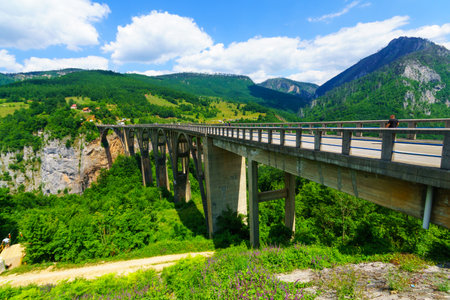 BUDECEVICA, MONTENEGRO - JULY 02, 2015: Scene of the Durdevica Tara Bridge, across the Tara River Canyon, with locals and tourists, in northern Montenegroのeditorial素材