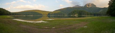 ZABLJAK, MONTENEGRO - JULY 02, 2015: Panoramic view of the Black Lake Crno jezero, with visitors, in Durmitor National Park, Montenegroのeditorial素材