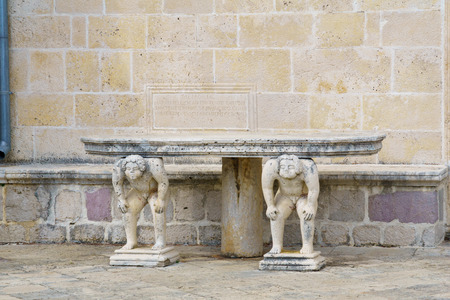 A Stone table in Our Lady of the Rocks church. On an artificial island in the Bay of Kotor, Montenegro. Memory plate is for the local Bishopの写真素材