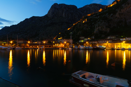 Night view in Kotor, with the old town walls and the bay, Montenegroの写真素材