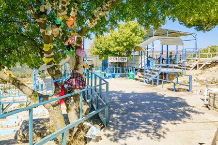 SAFED, ISRAEL - SEPTEMBER 18, 2015: A tree with traditional symbolic plastic bag attached, near the tomb of the ARI Rabbi Isaac Luria, in Safed, Israelのeditorial素材