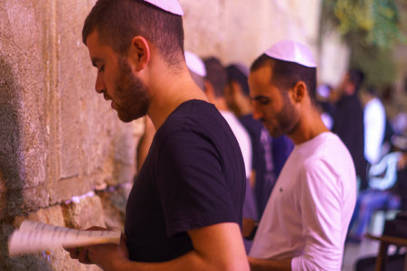 JERUSALEM, ISRAEL - SEPTEMBER 21, 2015: Jewish men pray Selichot Jewish penitential prays in the western wall, in the old city of Jerusalem, Israelのeditorial素材