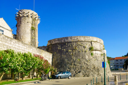 The Small Governor Tower or Lombardo Tower Mala Knezeva Kula, and the west side of the city walls large governor tower, in the old town of Korcula, Croatiaのeditorial素材