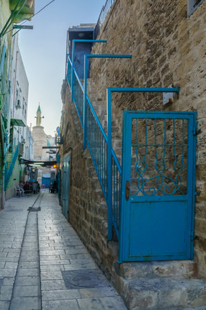 ACRE, ISRAEL - OCTOBER 01, 2015: Alley scene in the old city, with locals at a cafe, in Acre, Israelのeditorial素材