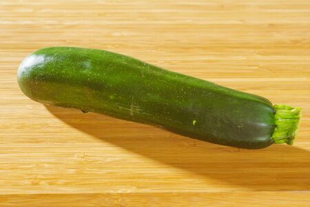 Zucchini on a wooden backgroundの写真素材