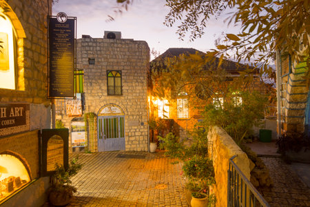 SAFED, ISRAEL - NOVEMBER 17, 2015: Sunset scene in an ally in the Jewish quarter, with local businesses, in Safed Tzfat, Israelのeditorial素材