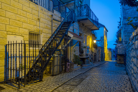 SAFED, ISRAEL - NOVEMBER 17, 2015: Sunset scene in an ally in the Jewish quarter, with local businesses, in Safed Tzfat, Israelのeditorial素材