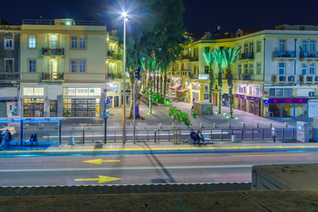 HAIFA, ISRAEL - NOVEMBER 23, 2015: Night scene in the renewed Turkish market, with local businesses, locals and tourists, in downtown Haifa, Israel. Its an old market-store from the 1920sのeditorial素材