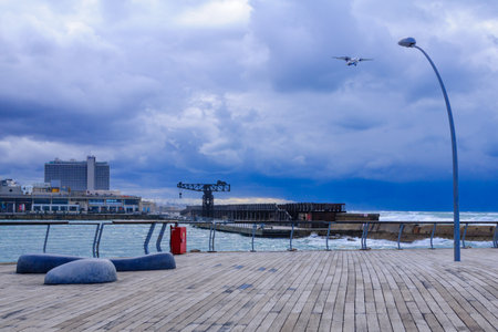 TEL-AVIV - JANUARY 25, 2016: Winter scene, in the Tel-Aviv Port compound, Israel. The port compound was restored as a dining and commercial areaのeditorial素材