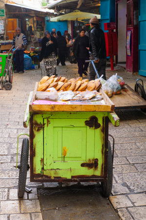 ACRE, ISRAEL - JANUARY 18, 2016: Market scene in the old city, with sellers and shoppers, in Acre, Israelのeditorial素材