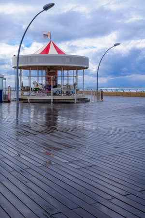 TEL-AVIV - JANUARY 25, 2016: Winter scene with a restored carrousel and a commercial area in Tel-Aviv Port, Tel-Aviv, Israel. The port compound was restored as a dining and commercial areaのeditorial素材