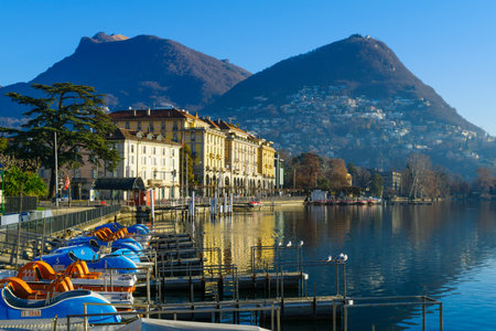 LUGANO, SWITZERLAND - DECEMBER 29, 2015: View of the lakeside promenade, with locals and visitors, in Lugano, Ticino, Switzerlandのeditorial素材