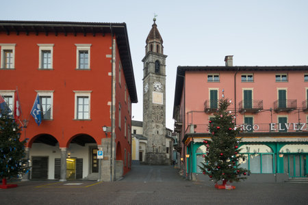 ASCONA, SWITZERLAND - DECEMBER 28, 2015: Scene of the lake promenade Piazza Mota, with the church tower, and local businesses, in Ascona, Ticino, Switzerlandのeditorial素材