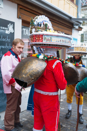 URNASCH, SWITZERLAND - DECEMBER 31, 2015: New Year Mummers, and spectators in Urnasch, Appenzell, Switzerland. Its part of the Silvesterchlausen tradition of greeting for the New Yearのeditorial素材