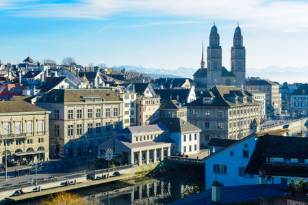ZURICH, SWITZERLAND - DECEMBER 27, 2015: View of the Old Town Altstadt, with the Grossmunster great minster Church, locals and visitors. In Zurich, Switzerlandのeditorial素材
