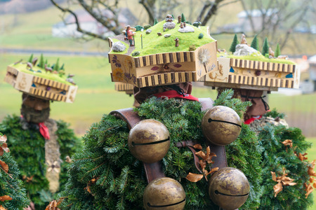 New Year Mummers near a farmhouse in Urnasch, Appenzell, Switzerland. Its part of the Silvesterchlausen tradition of greeting for the New Yearの写真素材