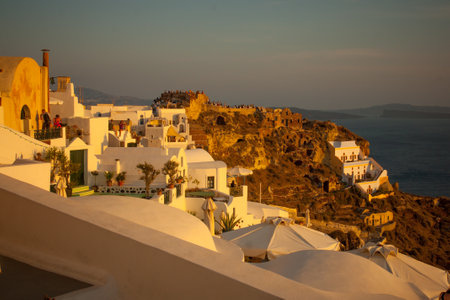 OIA, GREECE - SEPTEMBER 29, 2011: Sunset scene in the town of Oia, with locals and tourists, in the Santorini Thira Island, Greeceのeditorial素材