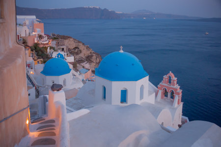 OIA, GREECE - SEPTEMBER 29, 2011: Sunset scene in the town of Oia, with locals and tourists, in the Santorini Thira Island, Greeceのeditorial素材
