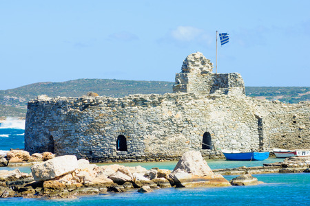 View of a small Venetian castle in the port of Naousa, Paros Island, Greeceの写真素材