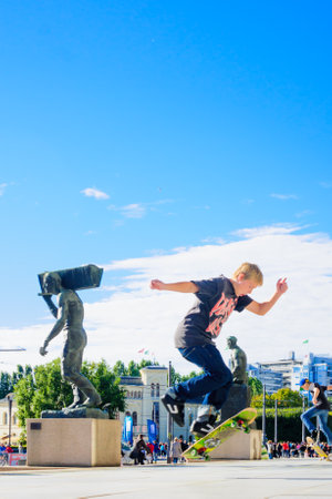 OSLO, NORWAY - SEPTEMBER 26, 2010: Scene of skateboarders and other people in downtown Oslo, Norwayのeditorial素材