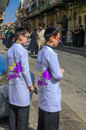 JERUSALEM, ISRAEL - FEBRUARY 25, 2016: Street scene of the Jewish Holyday Purim, with locals, some...