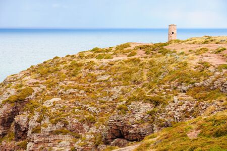 Landscape, coastline and lighthouse in Cap Frehel peninsula, in Cotes-dArmor, northern Brittany,...