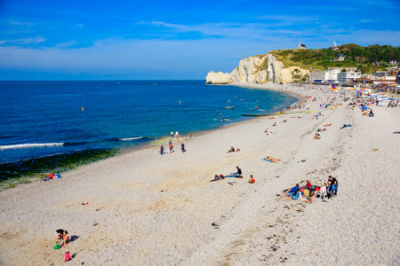 FECAMP, FRANCE - SEPTEMBER 16, 2012: Beach scene with Shore and cliffs, locals and visitors, in Fecamp, Haute-Normandie, Franceのeditorial素材