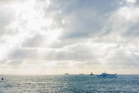 View of the Island of Brehat, with a boat and a lighthouse. Cotes-dArmor, northern Brittany, France