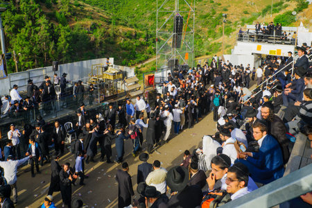MERON, ISRAEL - MAY 26, 2016: A crowd of orthodox Jews attend and dance the annual hillulah of Rabbi Shimon Bar Yochai, in Meron, Israel, on Lag BaOmer Holiday.のeditorial素材