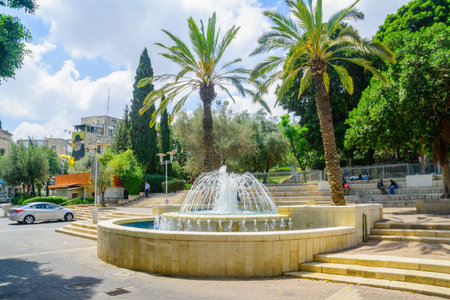 HAIFA, ISRAEL - AUGUST 18, 2016: View of Binyamin Garden, with a fountain, locals and visitors, in Hadar HaCarmel district, Haifa, Israelのeditorial素材