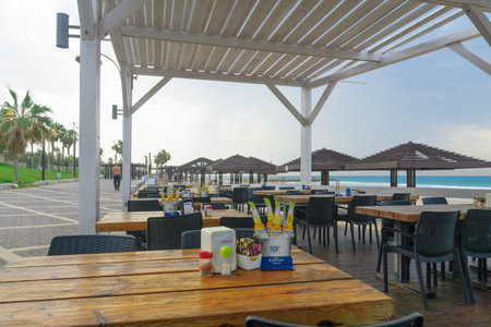 HAIFA, ISRAEL - OCTOBER 27, 2016: Beach promenade scene with workers and visitors, in Haifa, Israelのeditorial素材