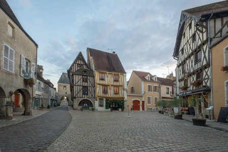 NOYERS-SUR-SEREIN, FRANCE - OCTOBER 11, 2016: Sunset view of the main square (place de hotel de...