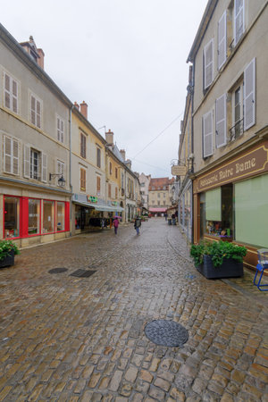 SEMUR-EN-AUXOIS, FRANCE - OCTOBER 13, 2016: Street scene in the medieval core of the town, with...